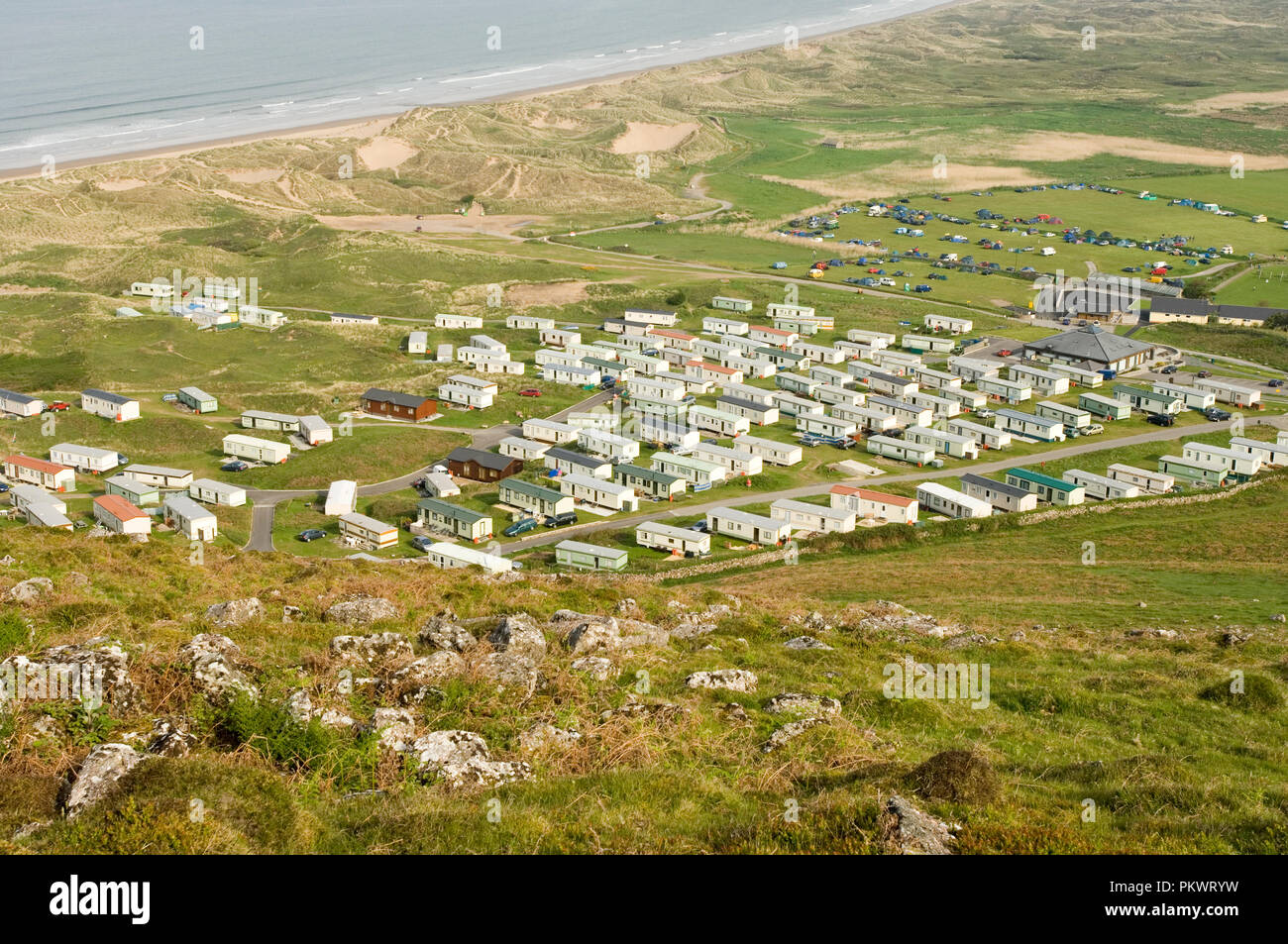 Holiday homes and campsite by the beach in Hillend near Llangennith in Rhossili Bay on the Gower Peninsula in Wales May 2006 Stock Photo
