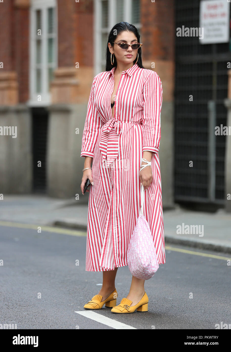 Kiki Baltzi, from Greece, wears Zara red stripe dress outside Freemasons'  Hall during the London Fashion Week September 2018 Stock Photo - Alamy