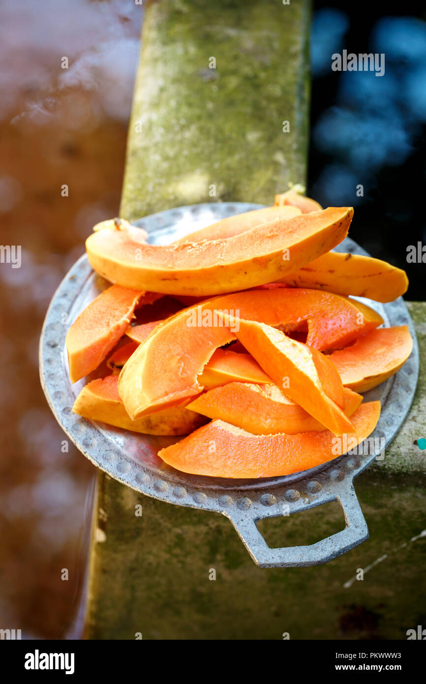 Ripe papaya without seeds cut into two halves Stock Photo Alamy
