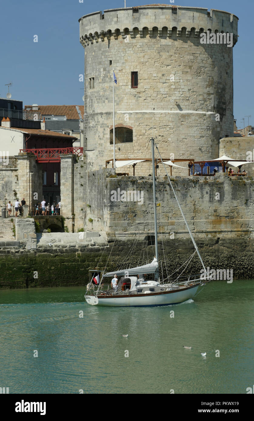 Pleasure boat entering La Rochelle fortified port Stock Photo