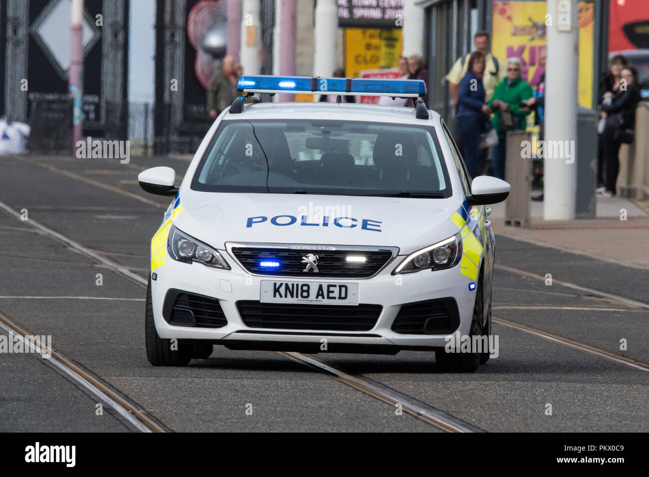 999 Emergency Police Responders; Vehicles using sirens and blue lights rush to crime incident in Blackpool, UK Stock Photo