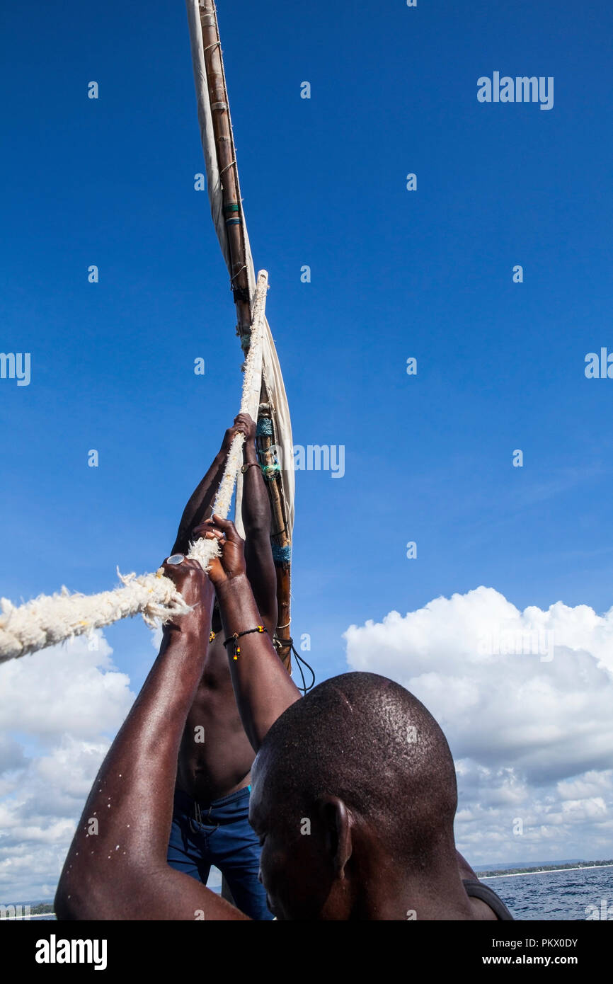 GALU - KINONDO, KENYA - FEBRUARY 26,2018: Lokal fishermen in Galu beach, Kenya. Every morning, with a boat made of mango tree, go fishing... Stock Photo