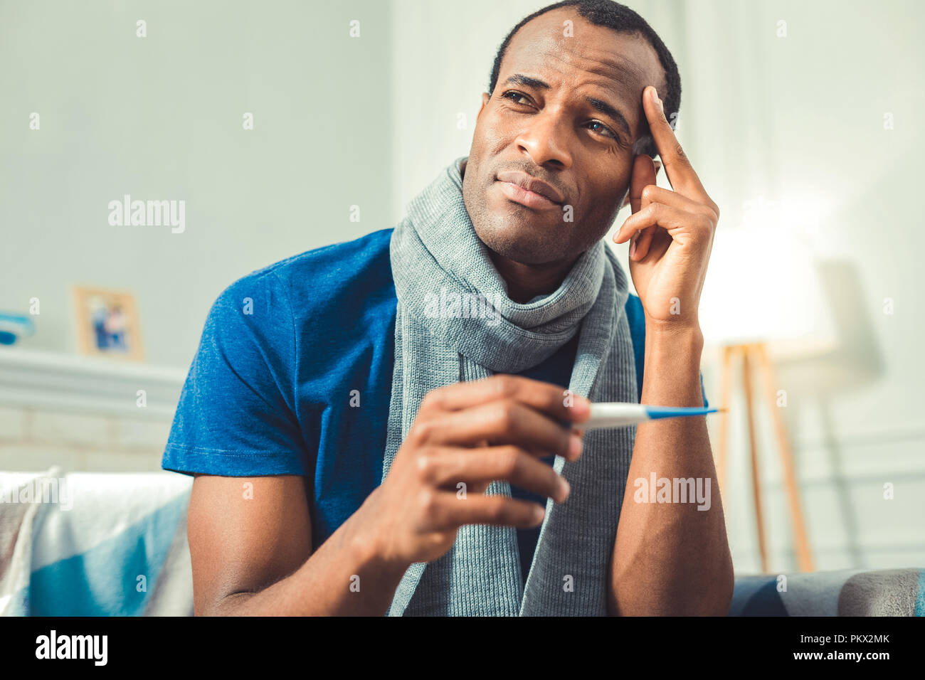 Thoughtful adult afro american man facing cold Stock Photo