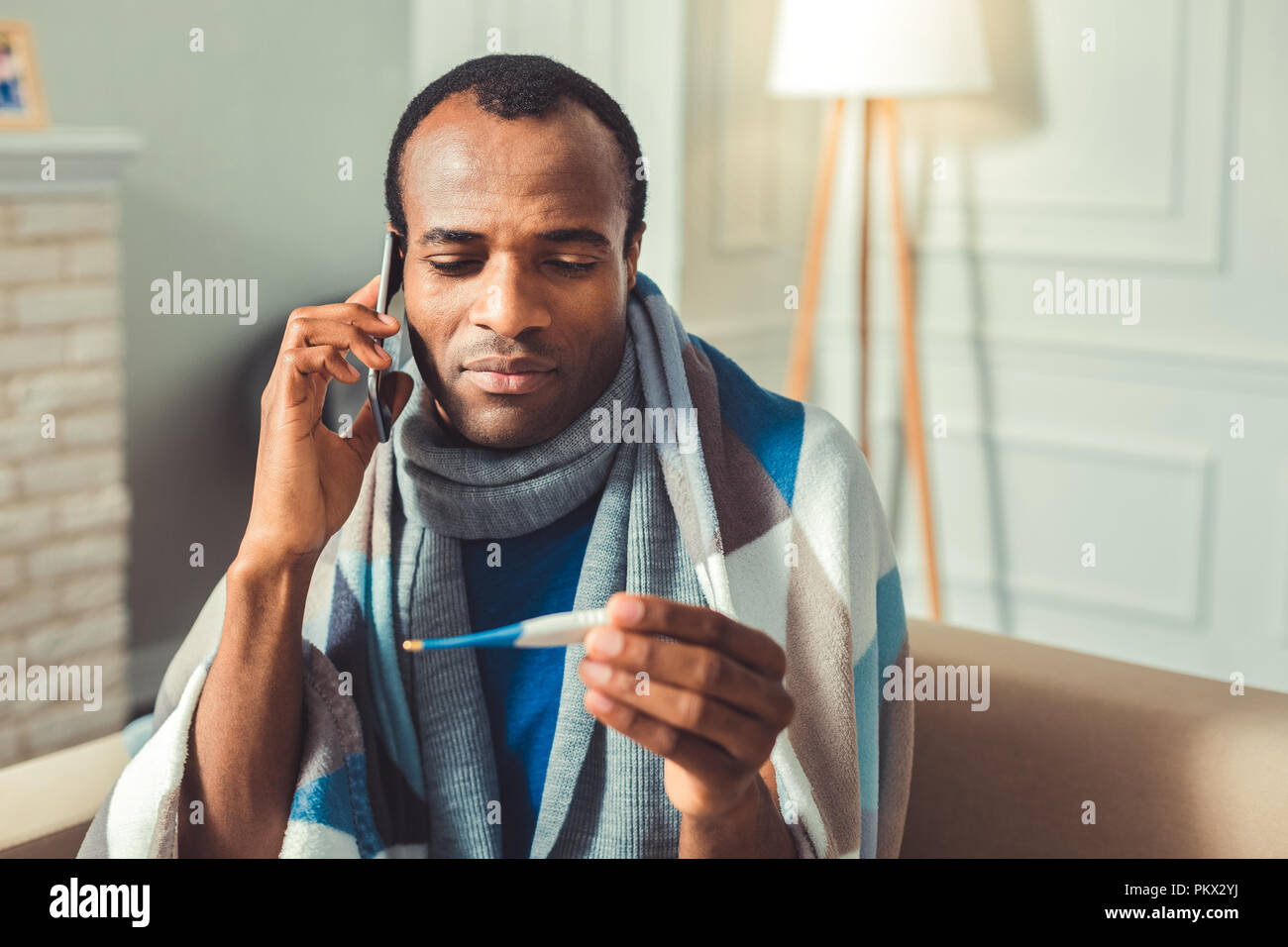 Serious afro american man consulting with doctor Stock Photo