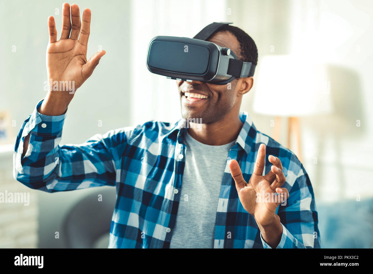 Happy afro american man using VR glasses Stock Photo