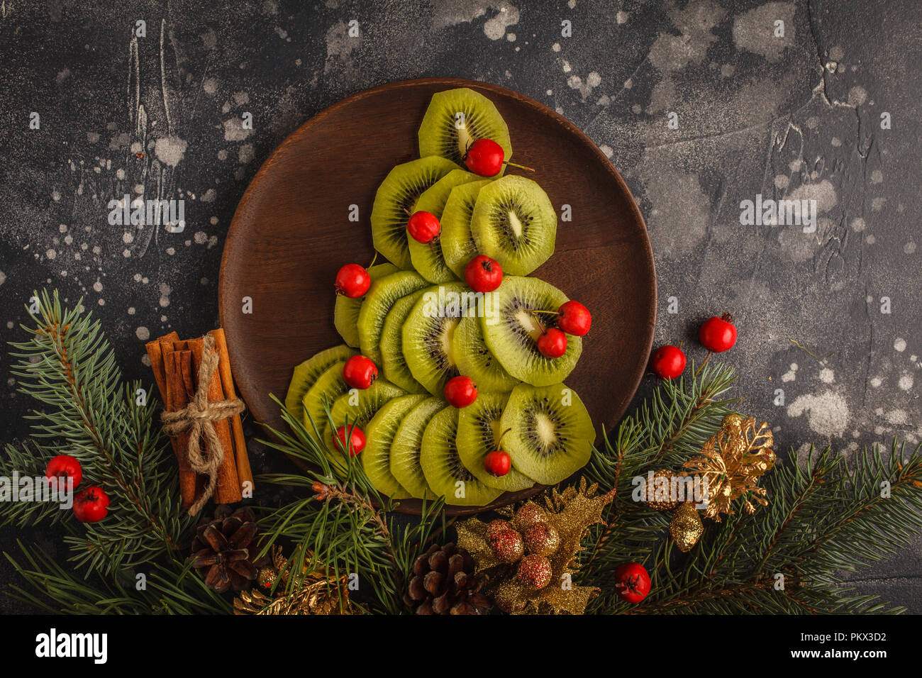 Christmas kiwi tree on a dark background. Christmas card concept Stock Photo Alamy