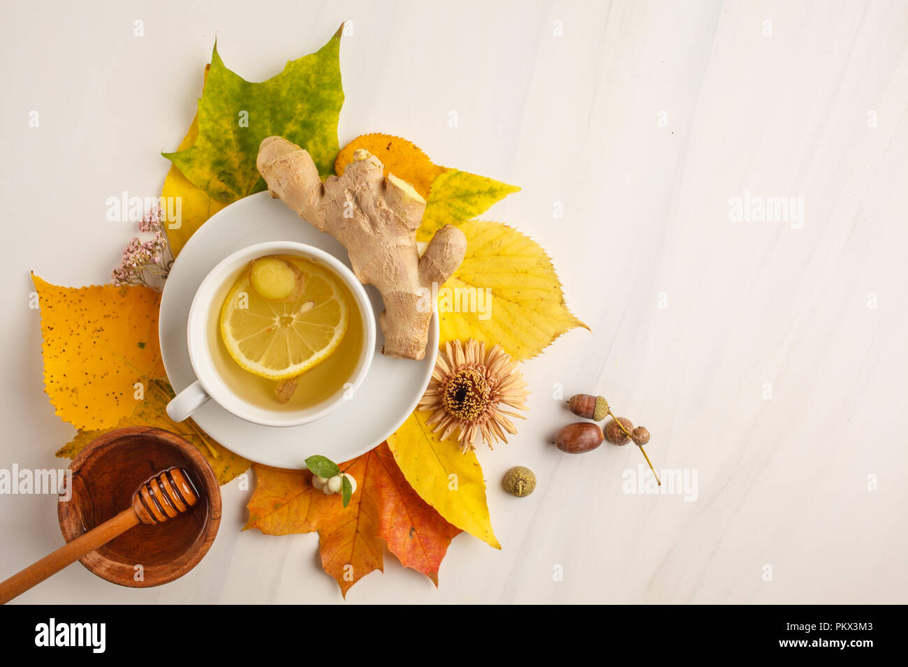 Autumn tea with ginger and lemon on a white background. Autumn ...