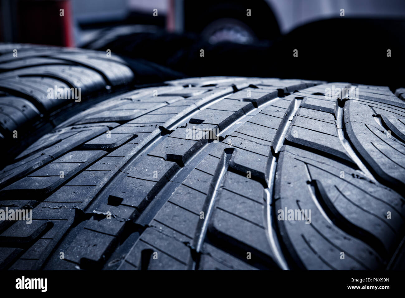 Extreme macro close up of tread grooves on racing car wet tires new set