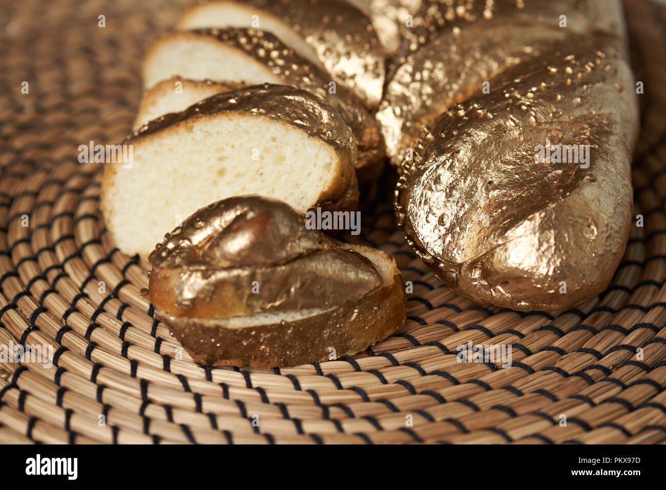 Cutted slices of golden bread laying on kitchen table close up Stock Photo