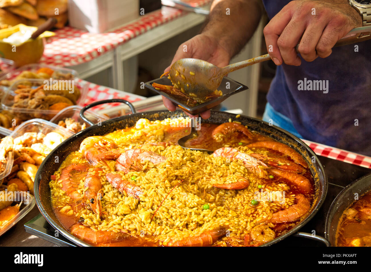 Paella preparation, street market stand near Barcelona Cathedral square