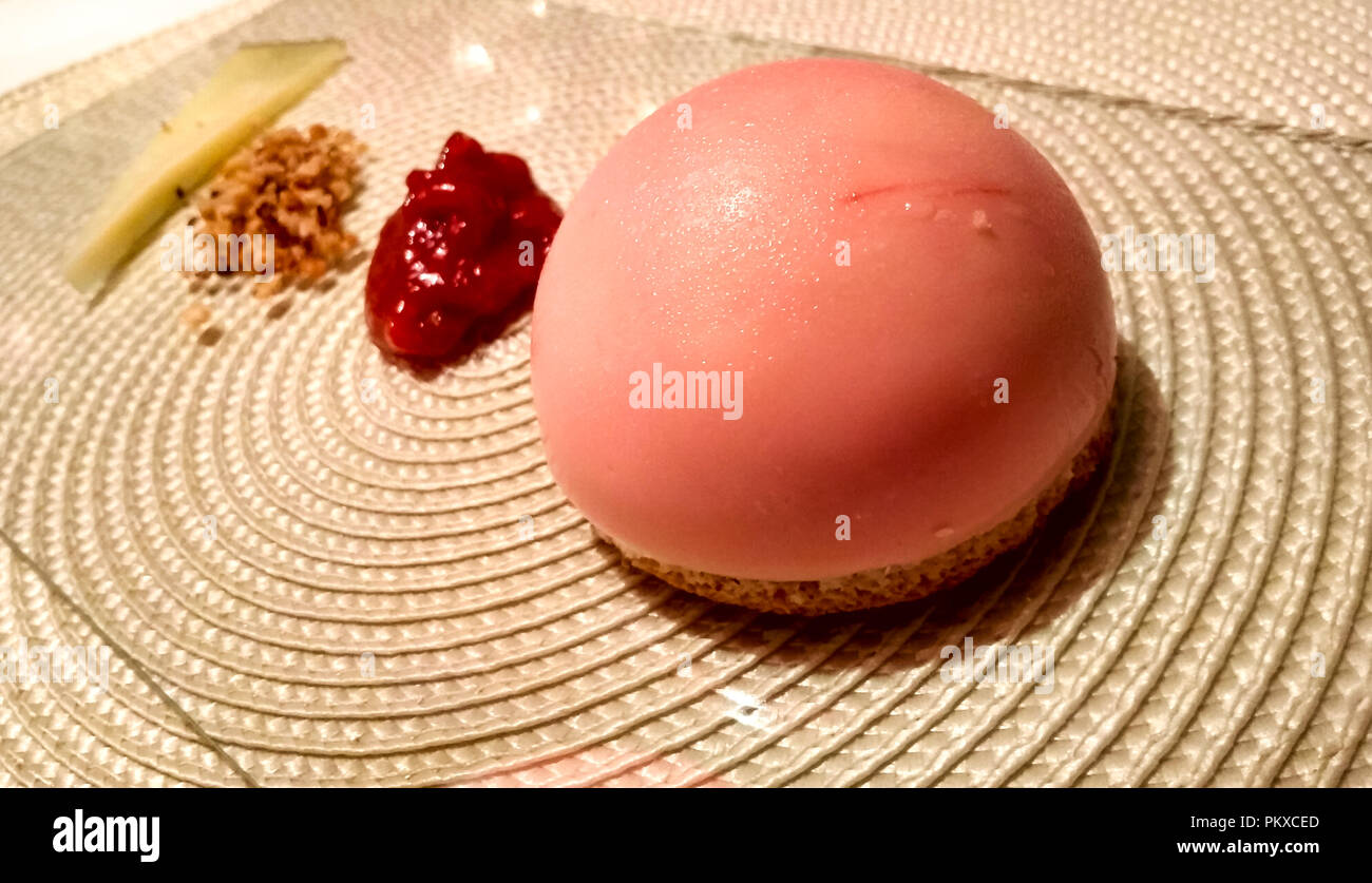 Beautiful gourmet dessert, scoop of ice cream in shell, guava paste