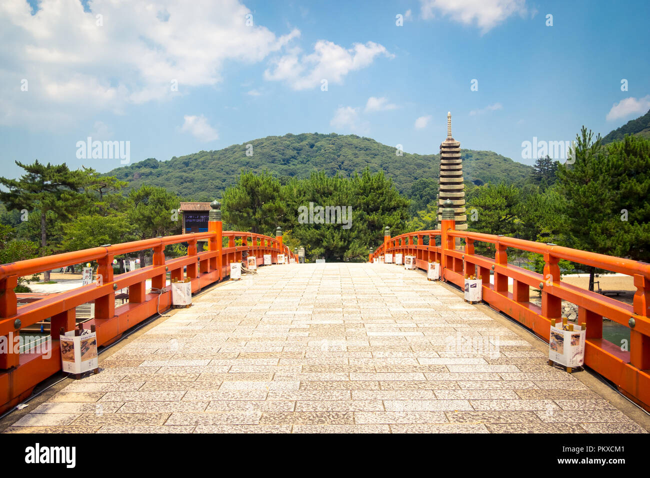 The Kisenbashi (Kisen-bashi, Kisen) Bridge and the 13-tiered stone pagoda (Jusanju Sekito) on Tonoshima (Tono-shima) Island in Uji, Japan. Stock Photo