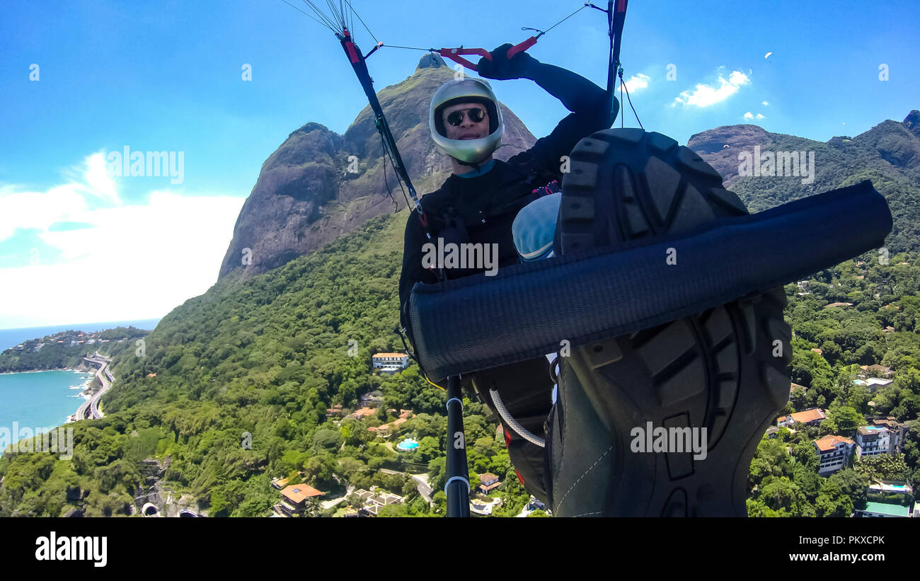 Paraglider pilot, physical handicapped, riding their own paragliding