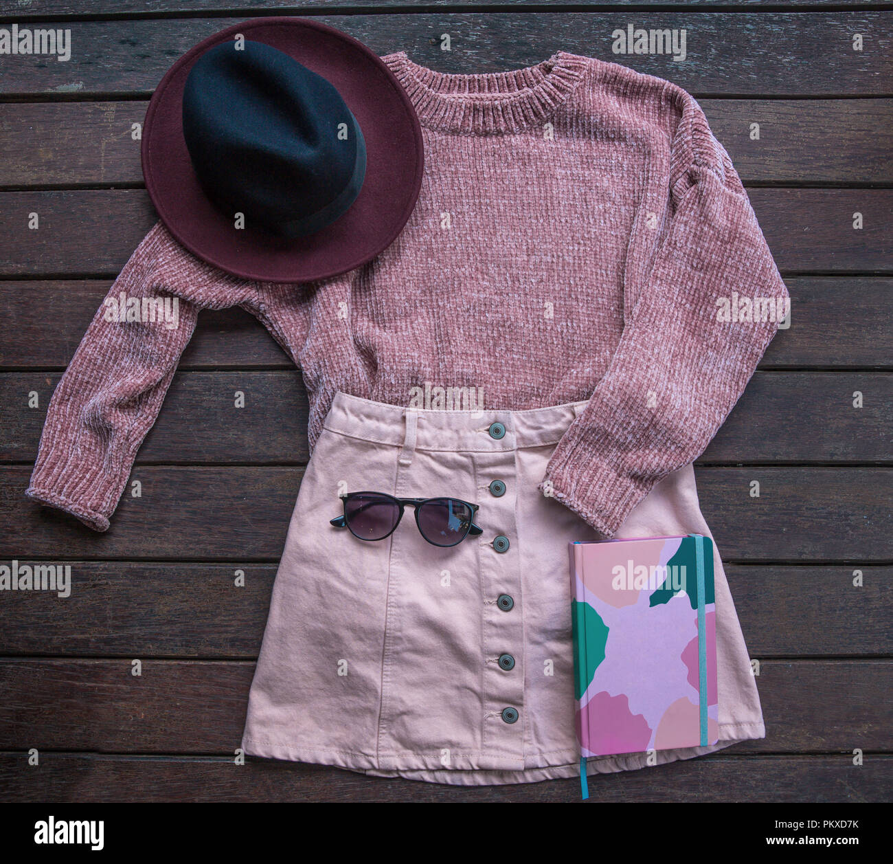 Autumn female outfit. Set of clothes, shoes and accessories on brown ...