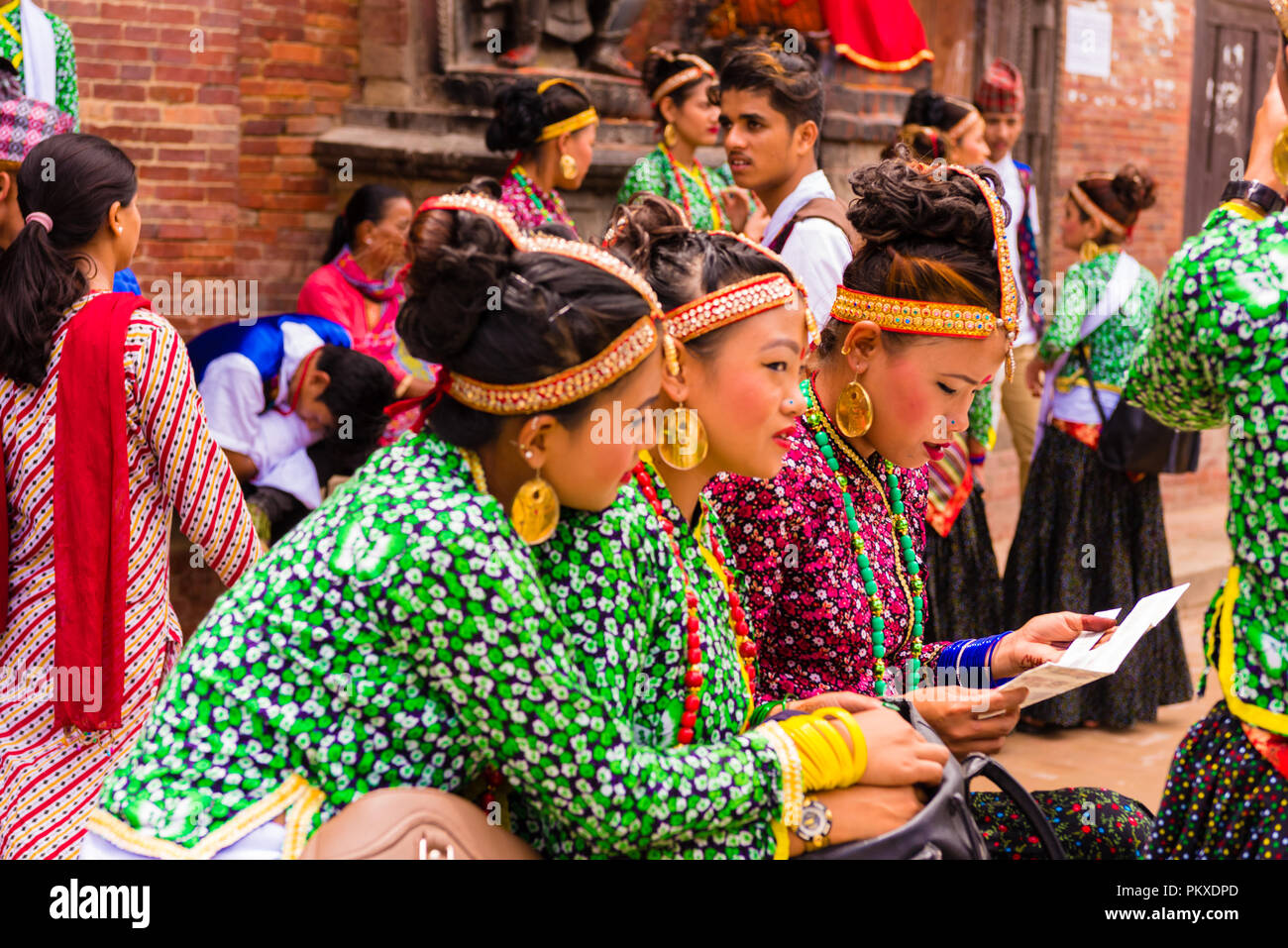 Patan, Lalitpur, Nepal - July 17, 2018 : Group of dancers wearing traditional costumes in Patan Durbar Square, UNESCO World Heritage Site Stock Photo