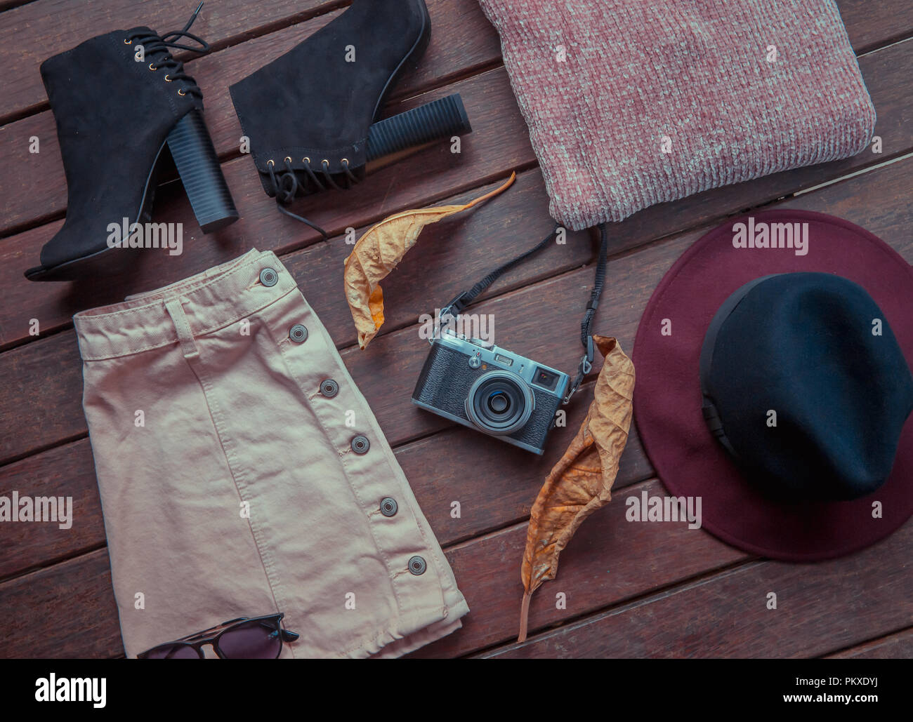 Autumn female outfit. Set of clothes, shoes and accessories on brown ...