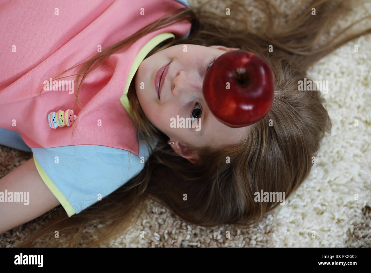 little girl lies on the floor Stock Photo - Alamy