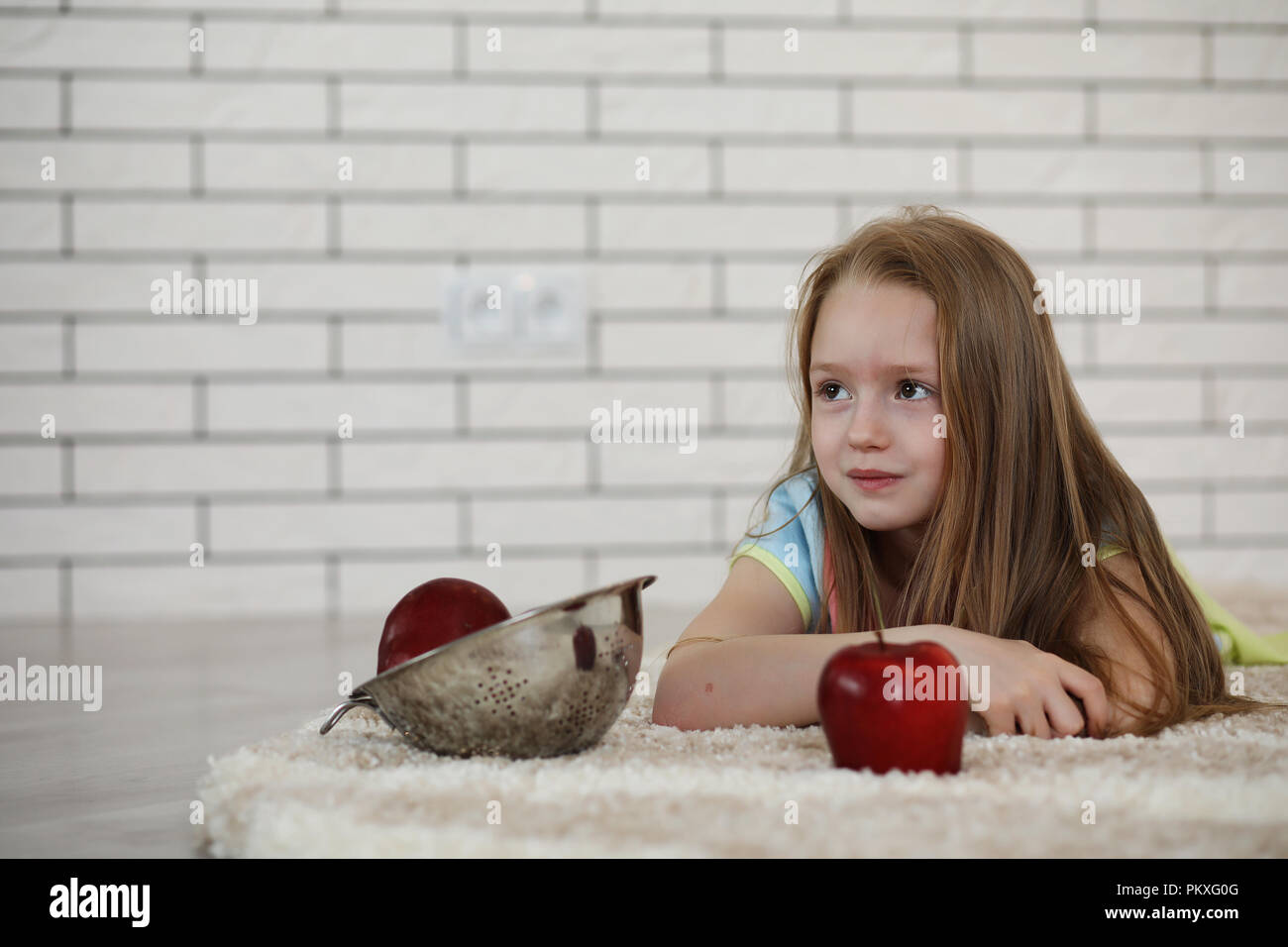 little girl lies on the floor Stock Photo - Alamy