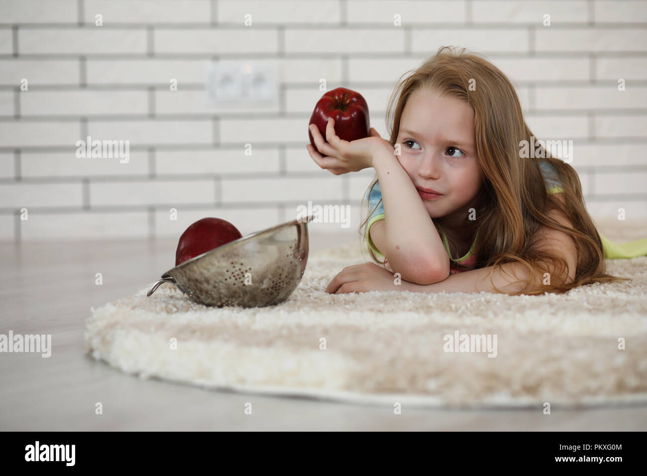 little girl lies on the floor Stock Photo - Alamy