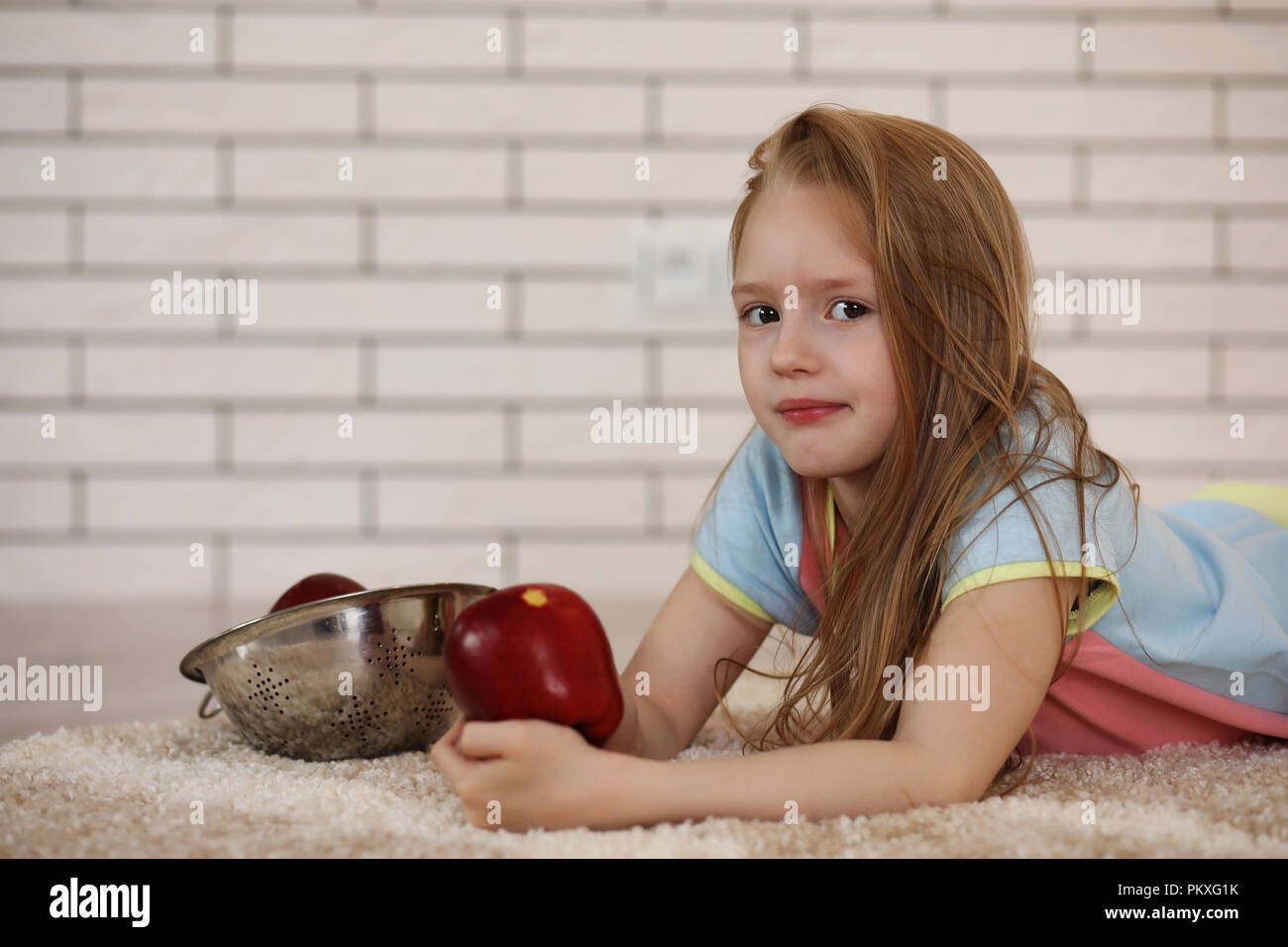 little girl lies on the floor Stock Photo - Alamy