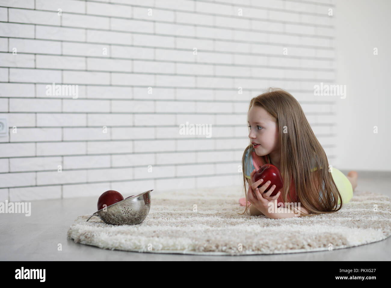 little girl lies on the floor Stock Photo - Alamy
