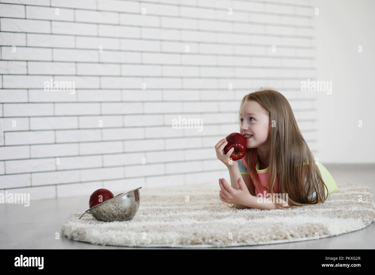 little girl lies on the floor Stock Photo - Alamy