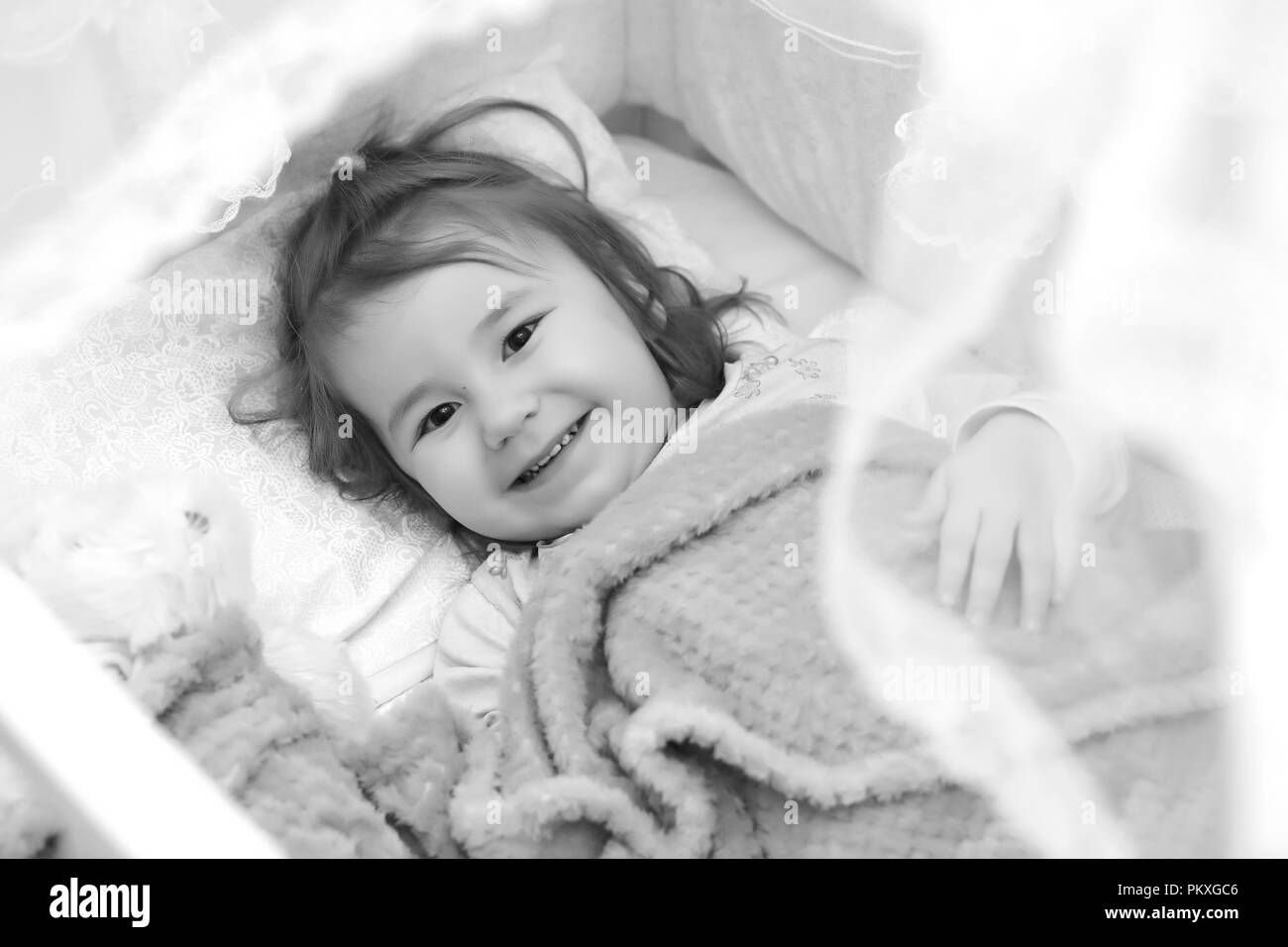 Little girl in bed on pillow Stock Photo Alamy