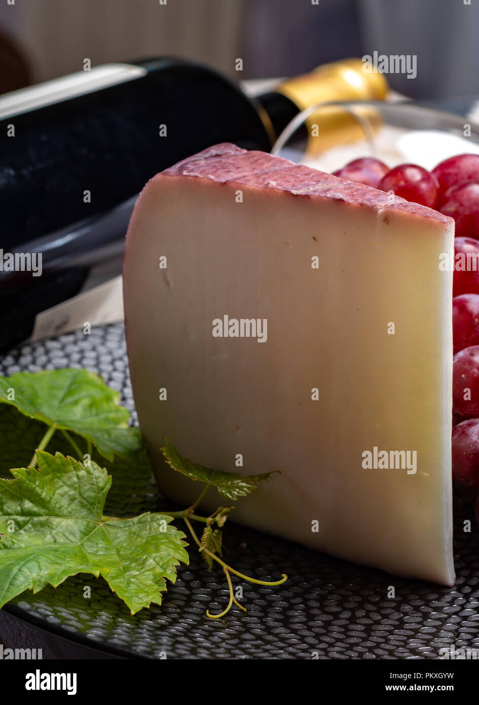 Traditional Spanish cheese, one piece of Murcian wine cheese from goat