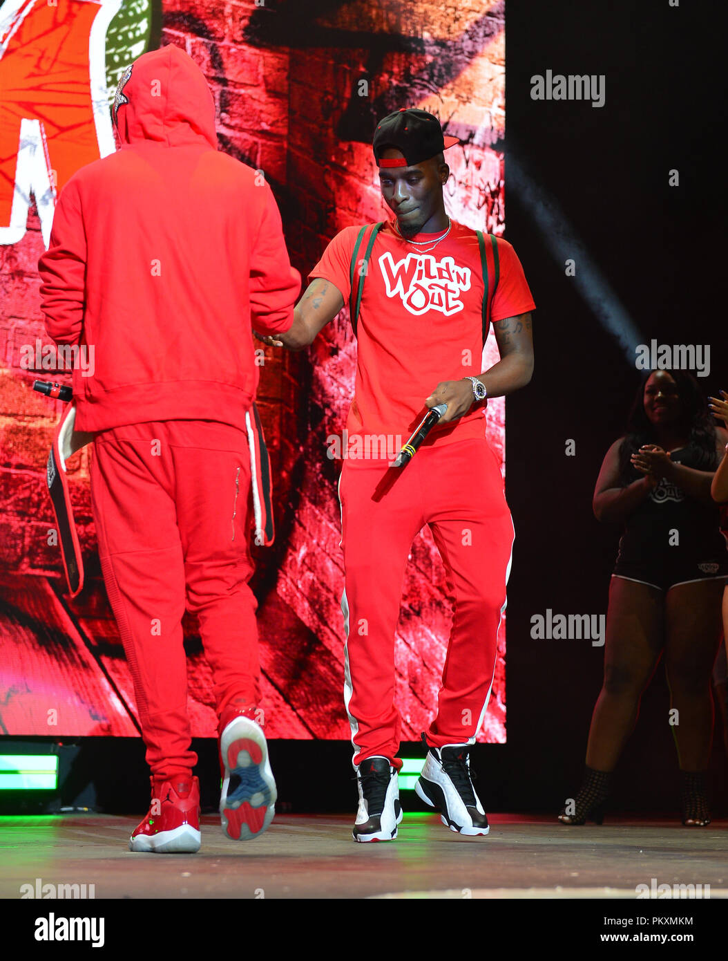 MIAMI, FL - SEPTEMBE 14: Nick Cannon and HitMan Holla performs on stage  during the NICK CANNON PRESENTS: WILD N OUT LIVE at American Airlines  Arena on September 14, 2018 in Miami,