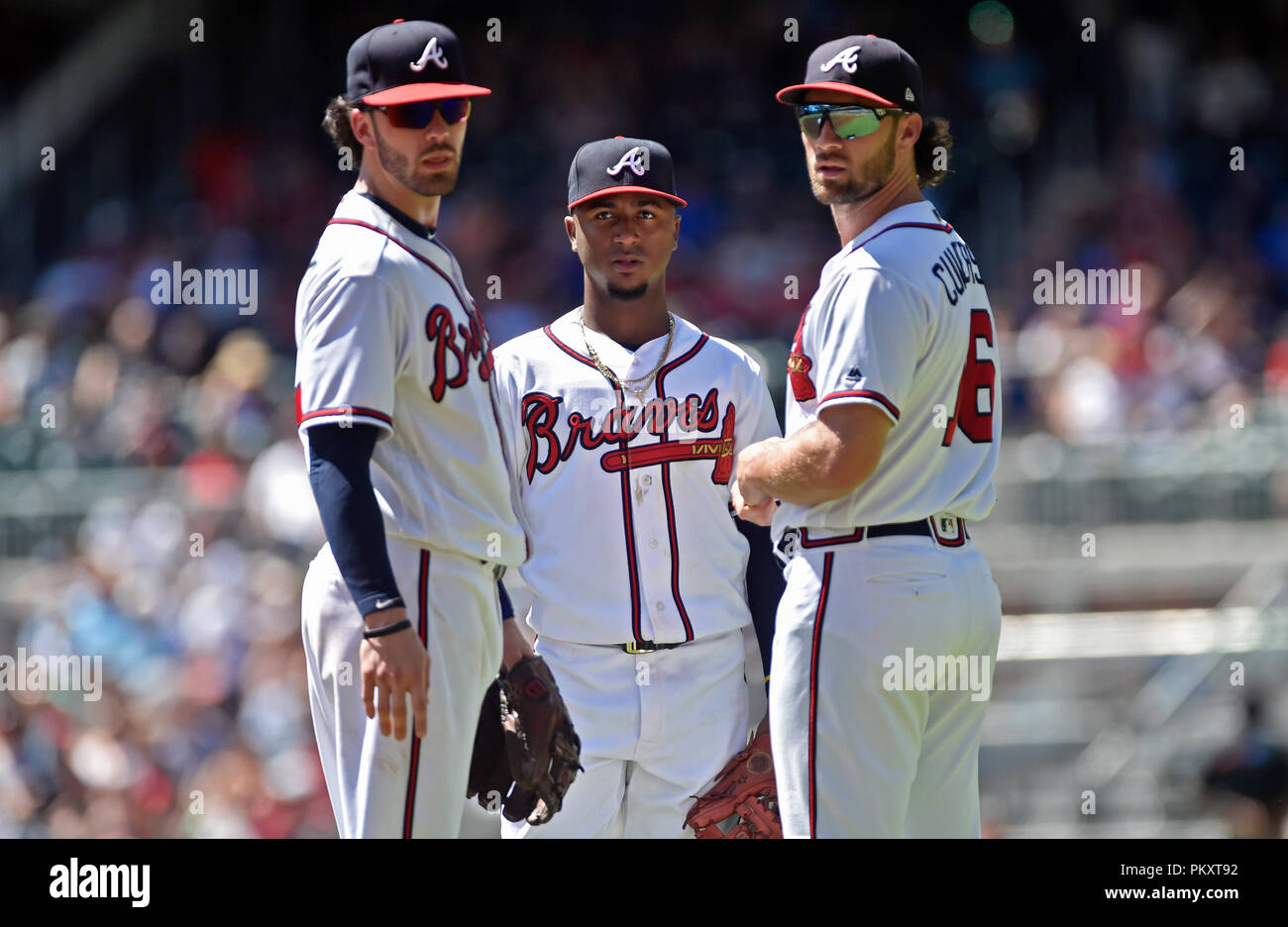 Atlanta, GA, USA. 15th Sep, 2018. Atlanta Braves infielders Dansby Swanson  (left), Ozzie Albies (center) and Charlie Culberson (right) meet during a  play review in the first inning of a MLB game