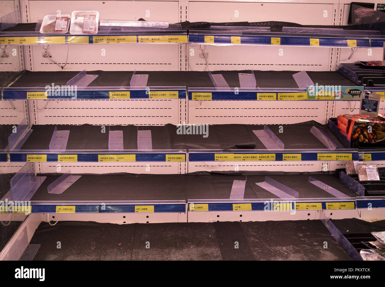 Hong Kong, Kowloon, Hong Kong. 15th Sep, 2018. Empty Supermarket meat shelves as residents stock up ahead of Super Typhoon Mangkhut arrival in Hong Kong, China. It is expected to land with a typhoon signal No. 8. Credit: Miguel Candela/SOPA Images/ZUMA Wire/Alamy Live News Stock Photo