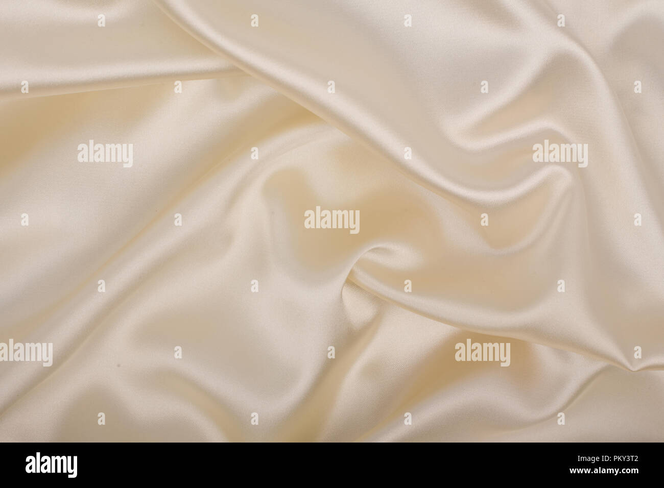Soft ecru satin, light background. Abstract luxury cloth or liquid wave ...