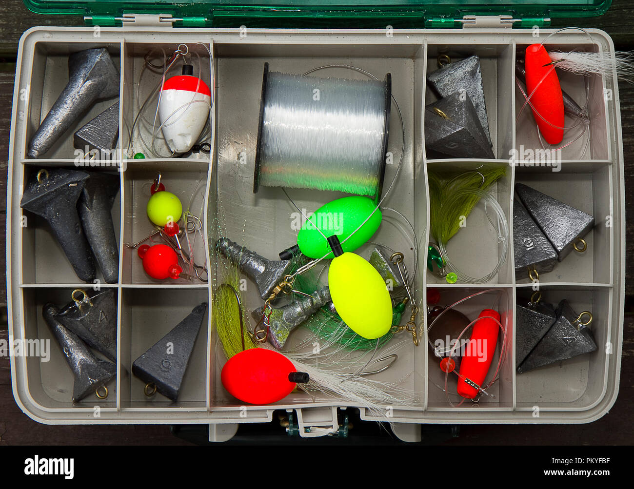 Inside tackle box of surf fishing weights and gear Stock Photo - Alamy