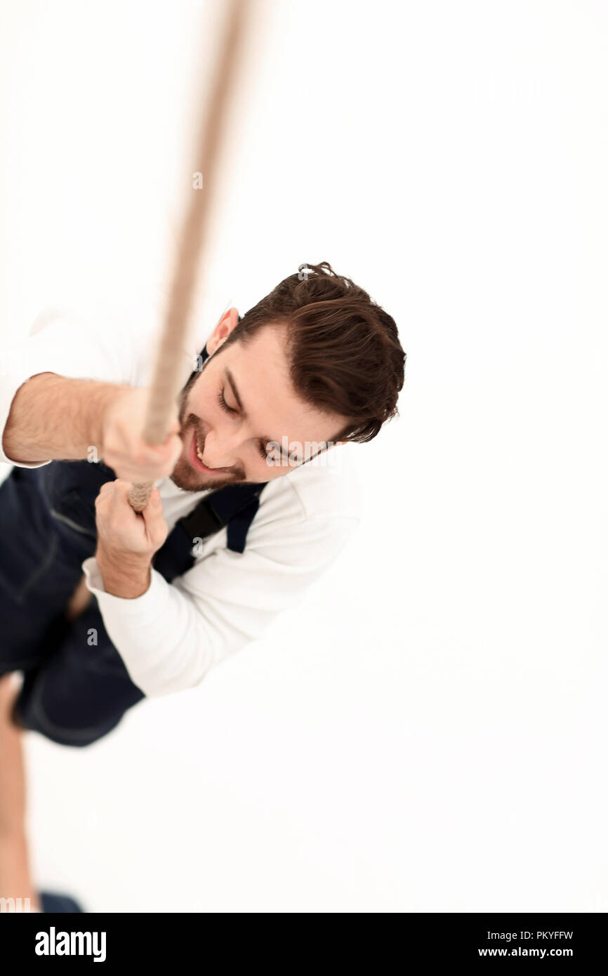 construction worker climbing the rope up Stock Photo Alamy