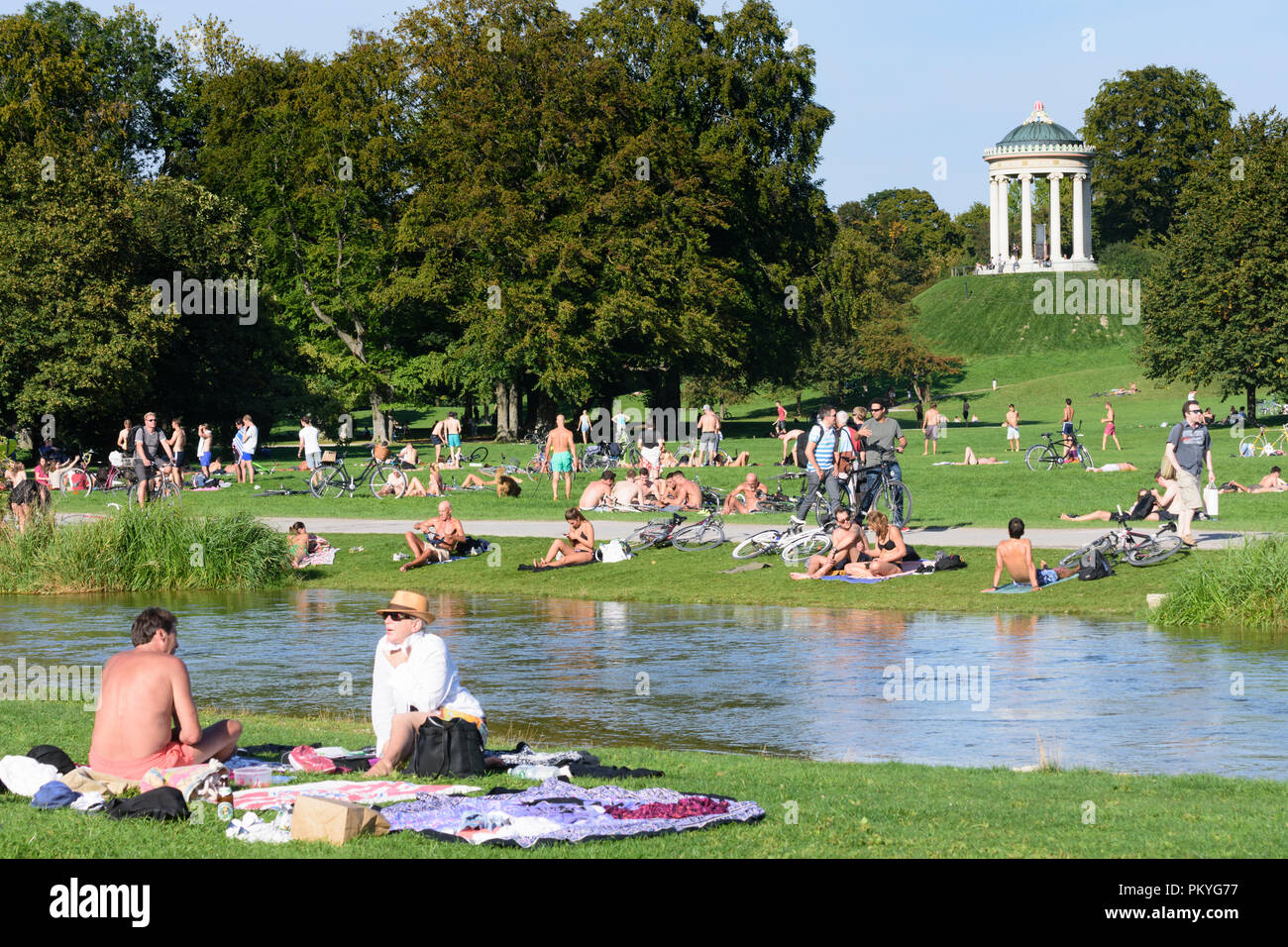 München, Munich: Englischer Garten (English Garden), view to temple Monopteros, stream Schwabinger Bach, bather, sunbather, people, Oberbayern, Upper  Stock Photo