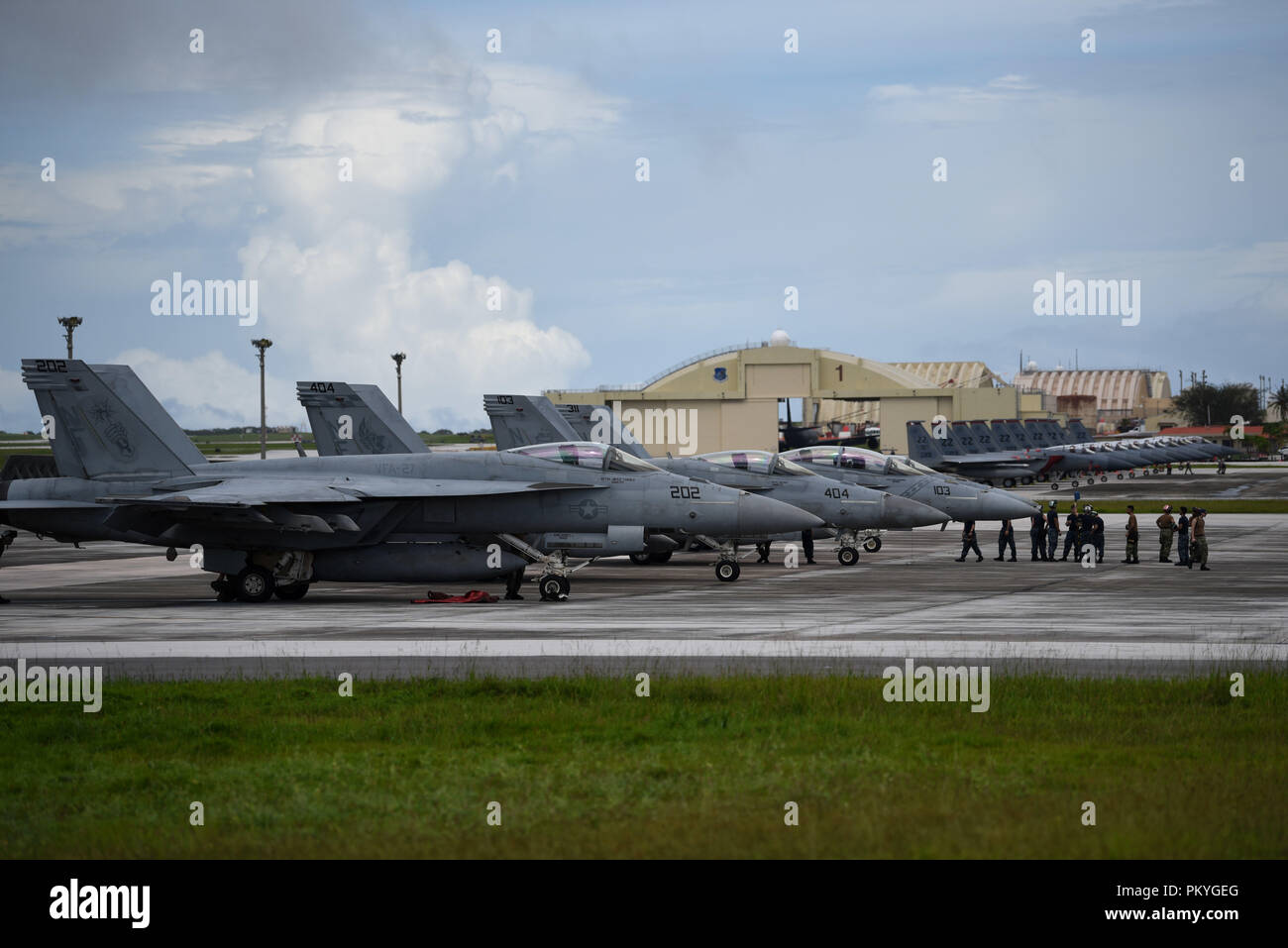 U.S. Navy F/A-18F/E Super Hornets arrive Sept. 15, 2018, at Andersen Air Force Base, Guam. The aircraft are set to participate in exercise Valiant Shield 2018. Valiant Shield is a biennial, U.S. only, field training exercise with a focus on integration of joint training among U.S. forces. (U.S. Air Force photo by Senior Airmen Gerald R. Willis) Stock Photo