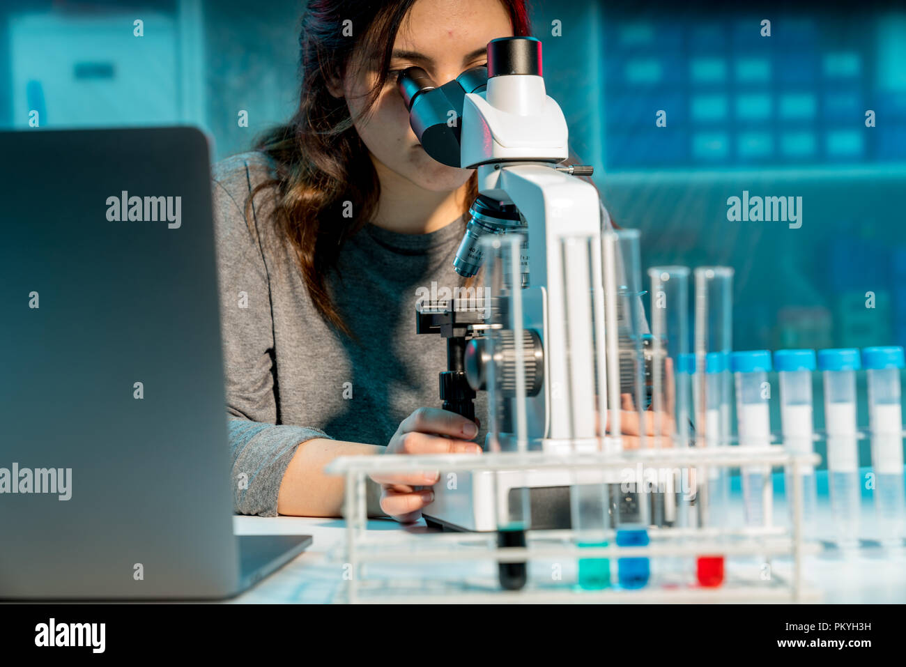 Woman conducting research in laboratory hi-res stock photography and ...