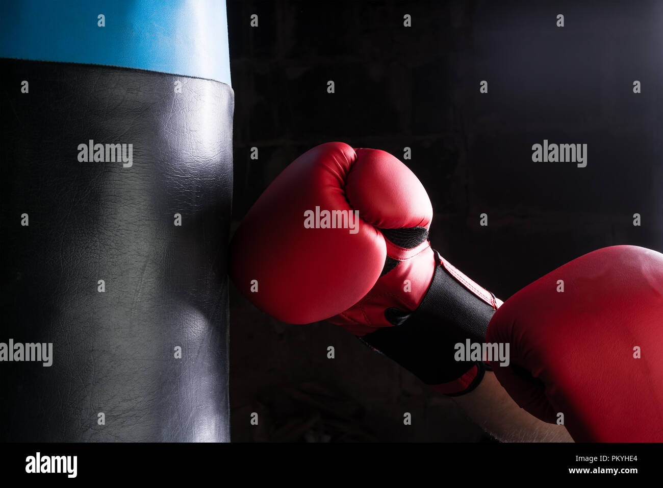 Man hitting punching bag hires stock photography and images Alamy