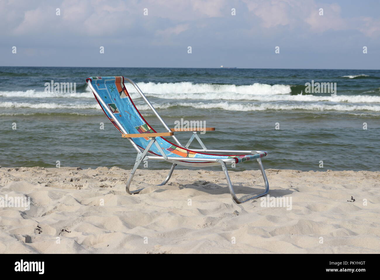 Empty deckchair on the beach in September, end of summer season by the sea Stock Photo