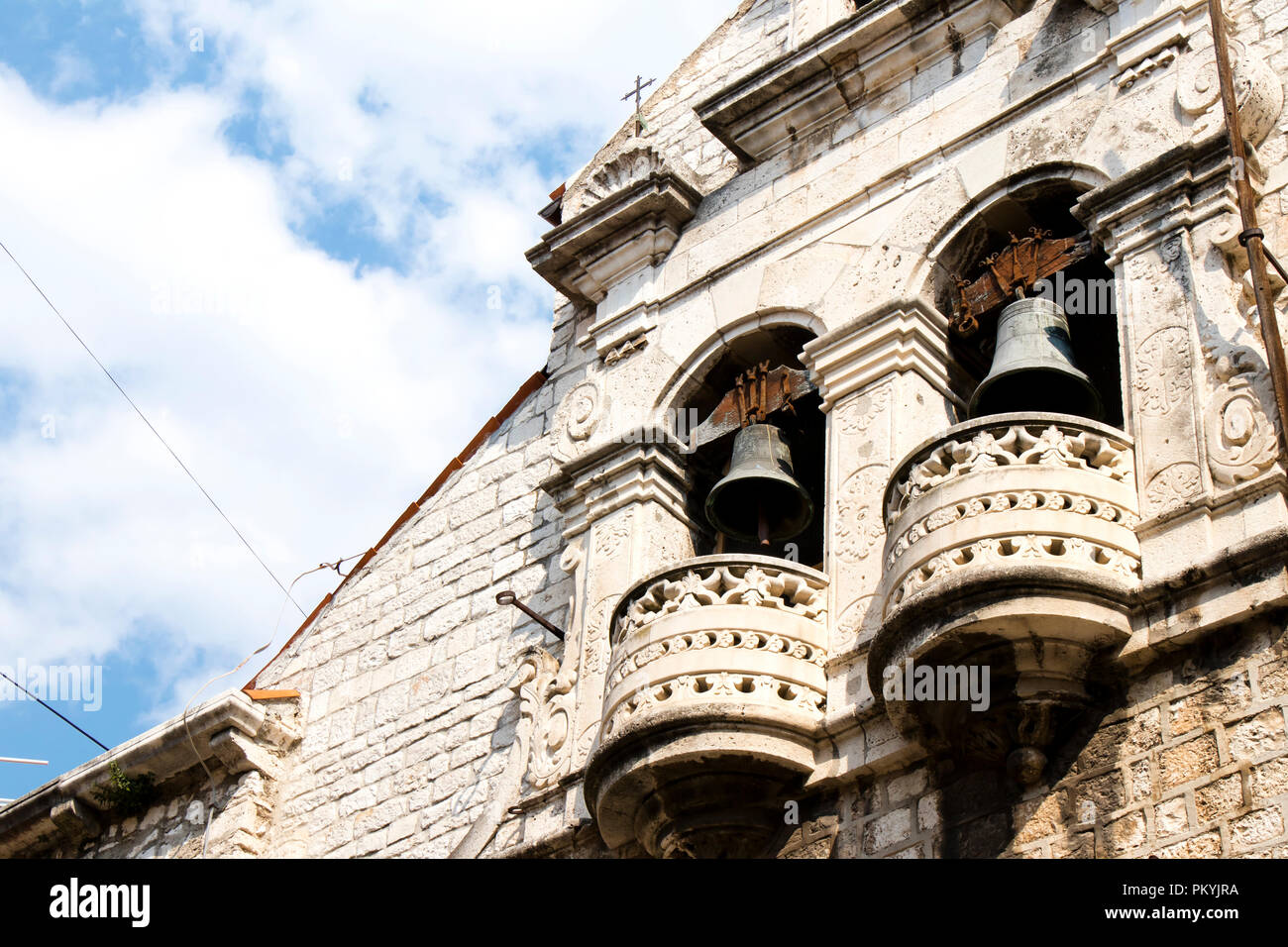 Serbian orthodox Church of the Assumption of the Virgin Mary, detail with bells,  in old town Sibenik , Croatia, low angle view Stock Photo