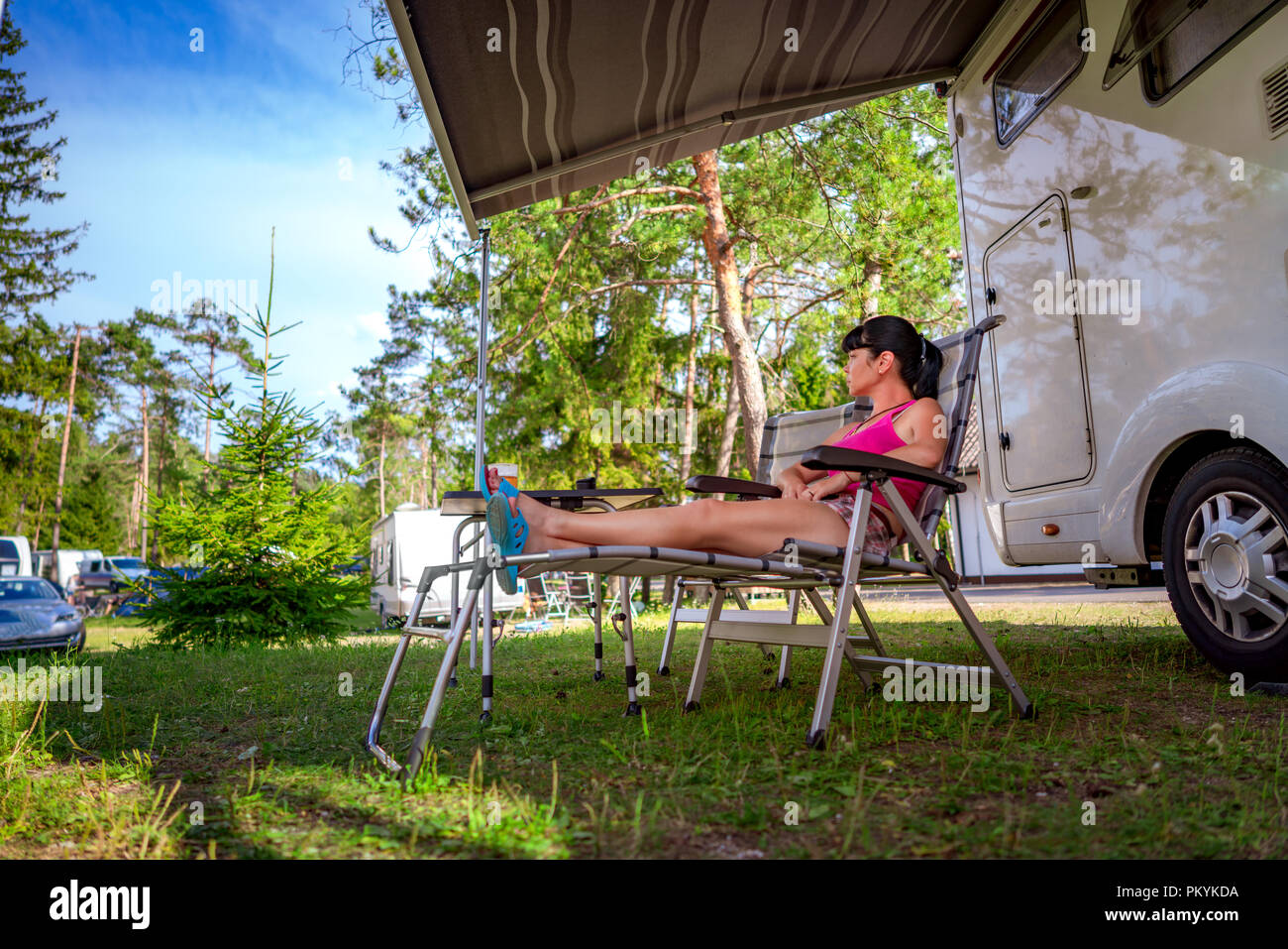 Woman In Rv Woman resting near motorhomes in nature. Family vacation travel ...