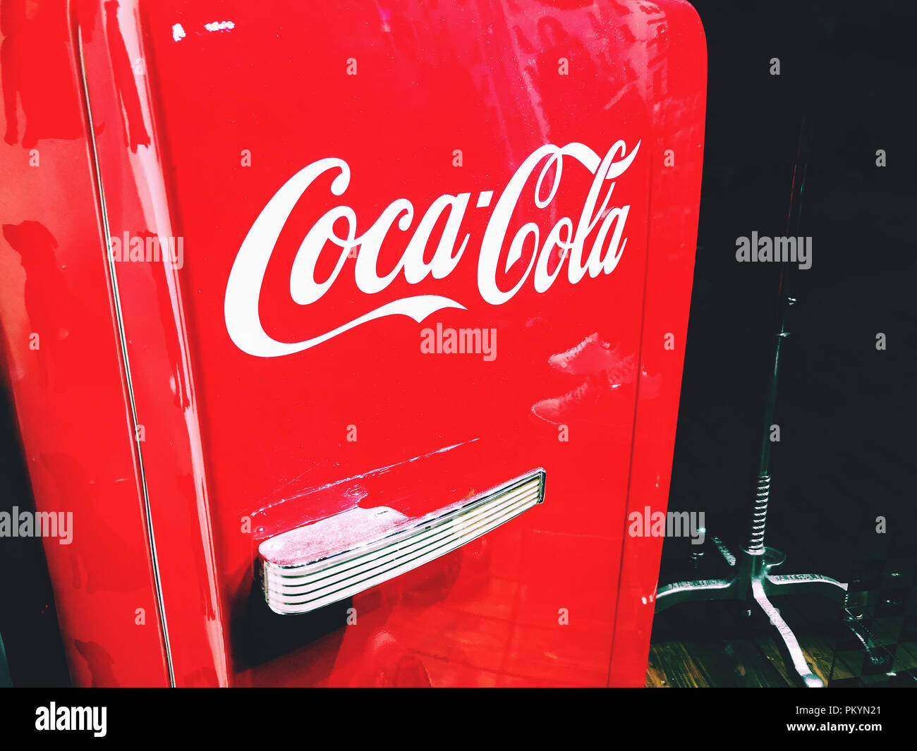 Coca Cola logo on a coke red retro fridge refrigerator Stock Photo