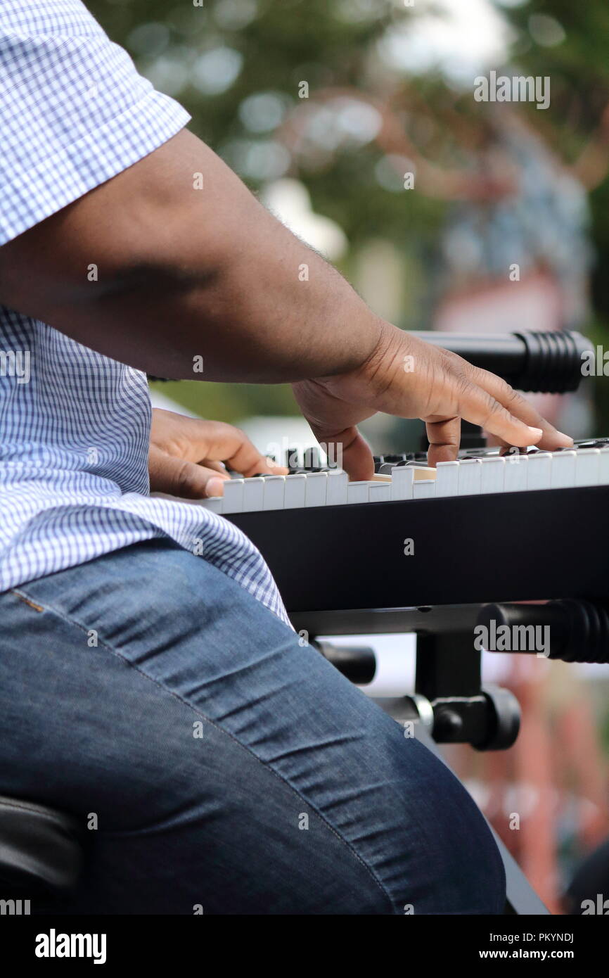 Black man playing a keyboard Stock Photo
