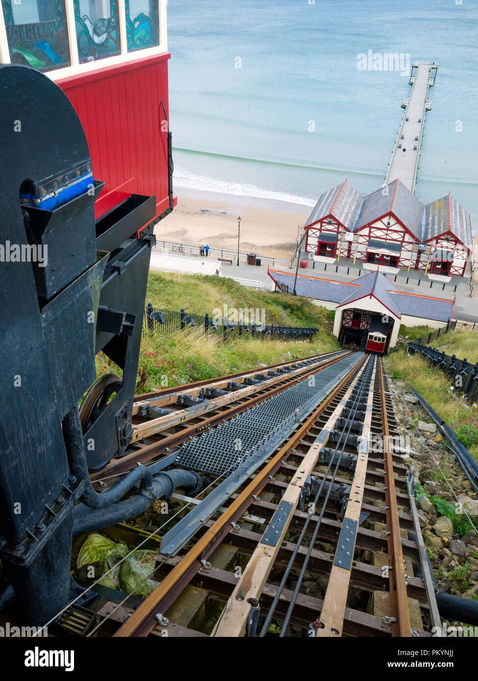 View from the top station of the Saltburn Hydraulic Funicular cliff lift looking down to the pier with new tracks after refurbishment in 2018 Stock Photo