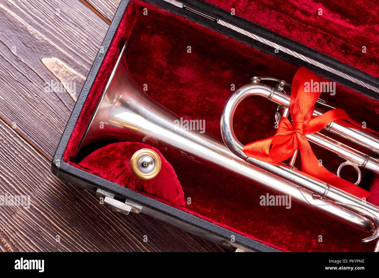 Christmas silver trumpet in box. Brass trumpet in velvet case