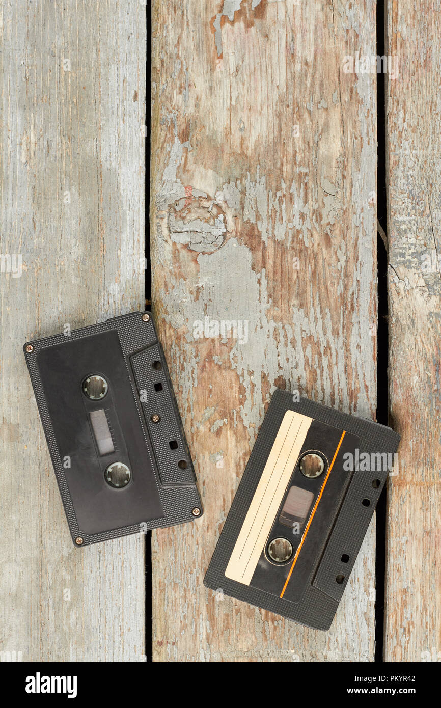 Retro cassette tapes on wooden boards. Vintage audio cassettes on