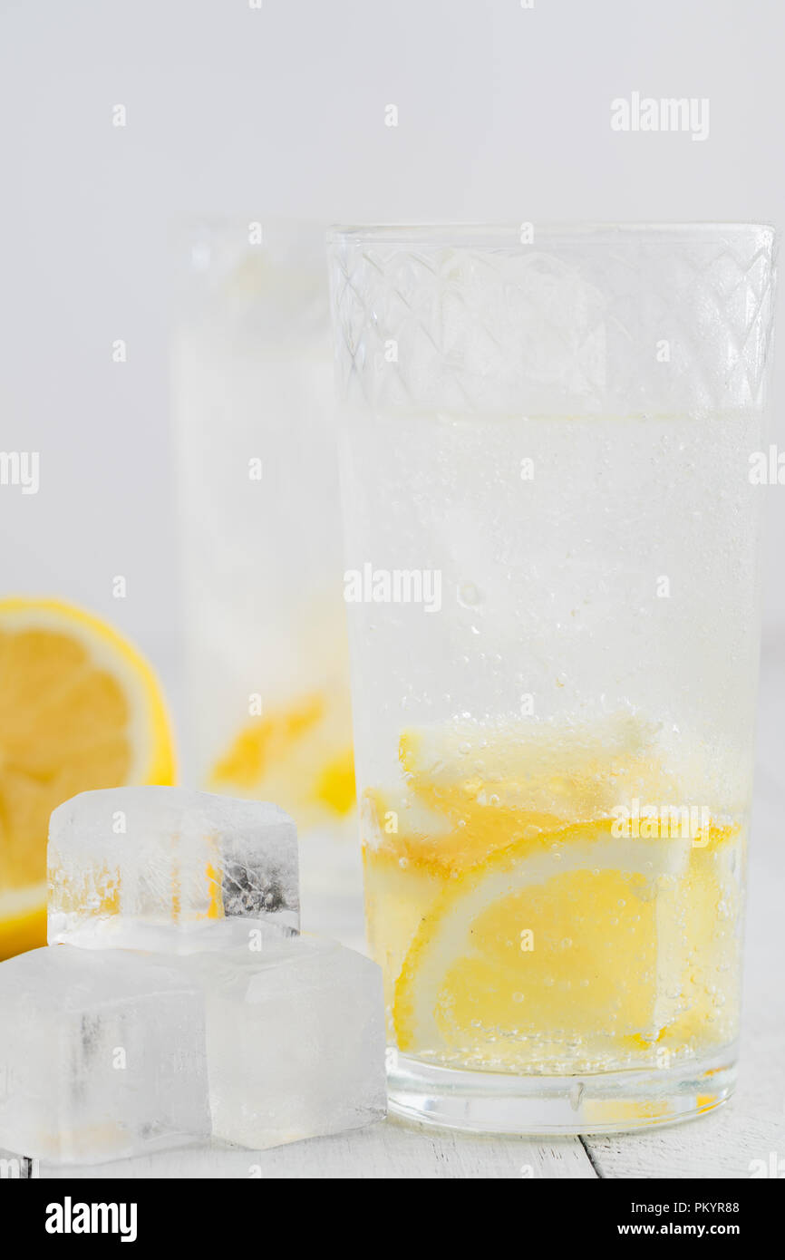 Lemon juice detox water. Mineral water infused with lemons Stock Photo