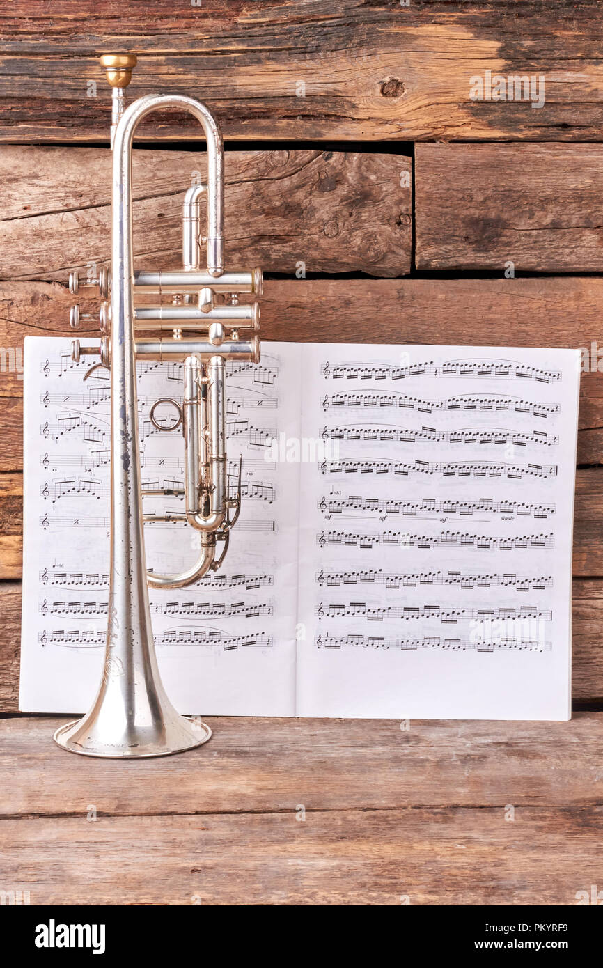 Trumpet and musical notes sheets Stock Photo Alamy