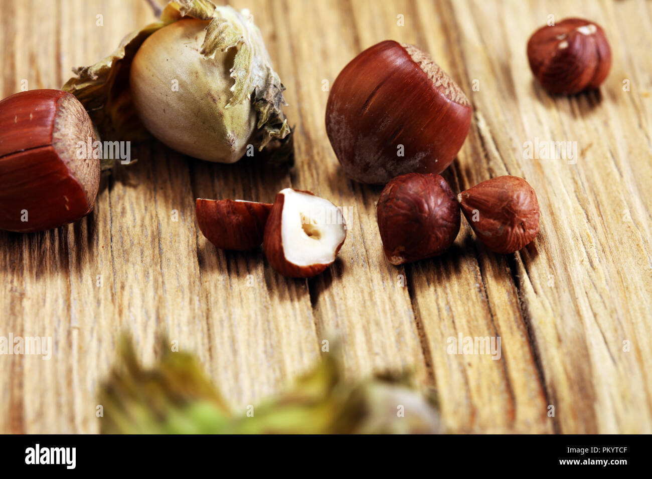 Exploded Hazelnut hazelnut with shell and craked and hazelnut leaves Stock Photo - Alamy