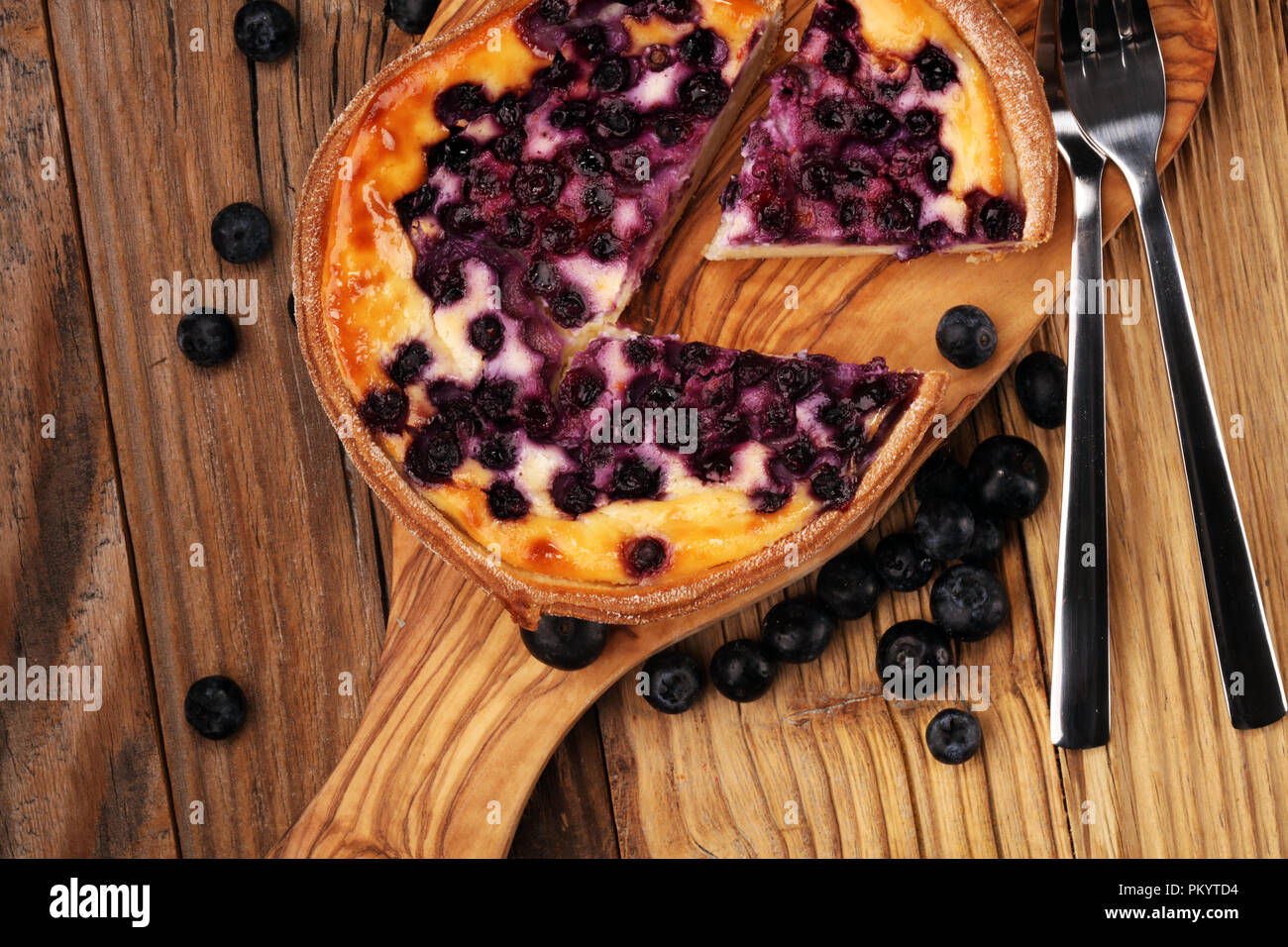 Blueberry pie or homemade cheesecake with blueberries. Delicous dessert blueberry tart. Stock Photo